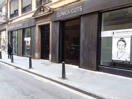 Clinica Dental Cots logo