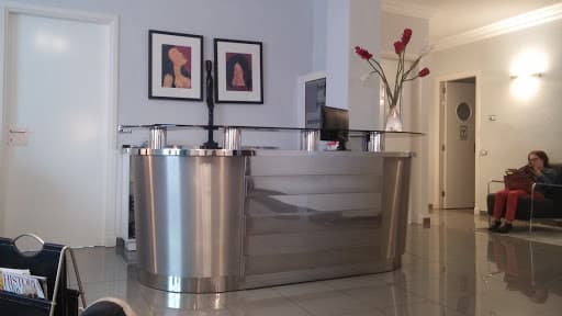 Clinica Dental CADE logo