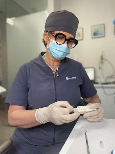 Clinica Dental AMEDENT logo