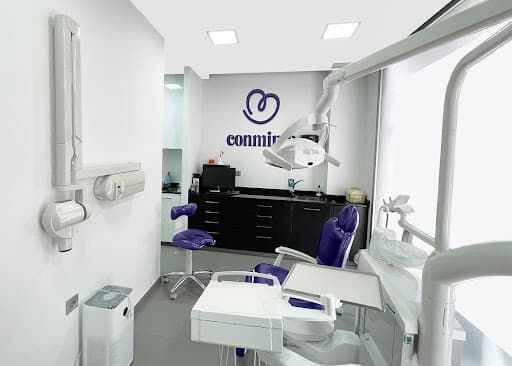Clinica Dental Conmimo logo